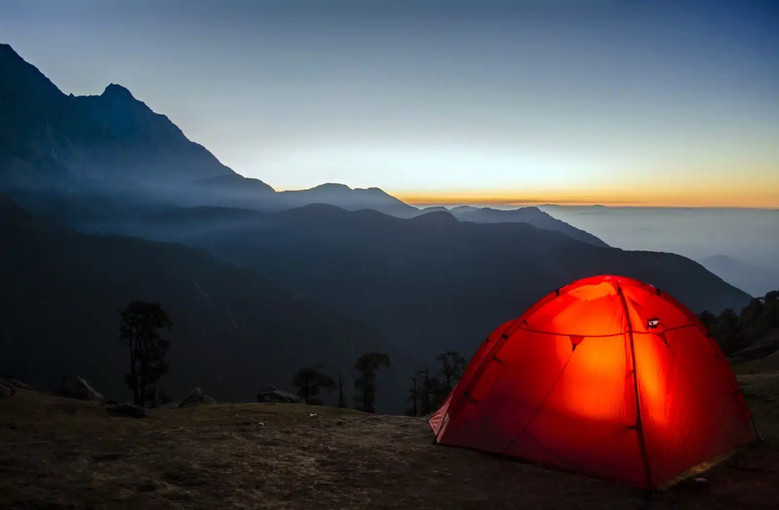 photo of tent on top of a mountain