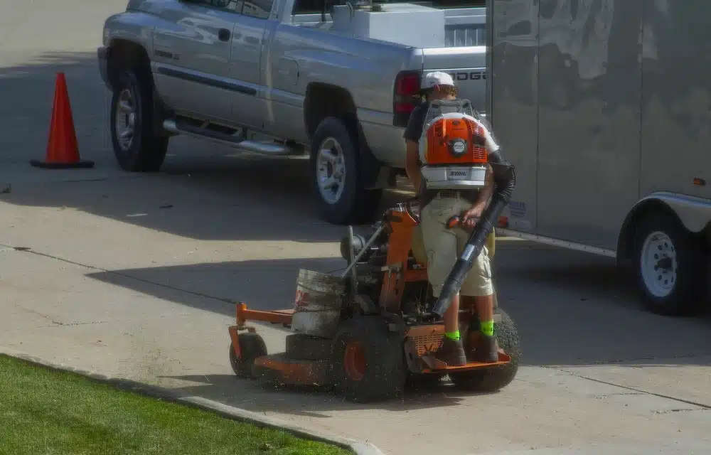 man using a lawn mower