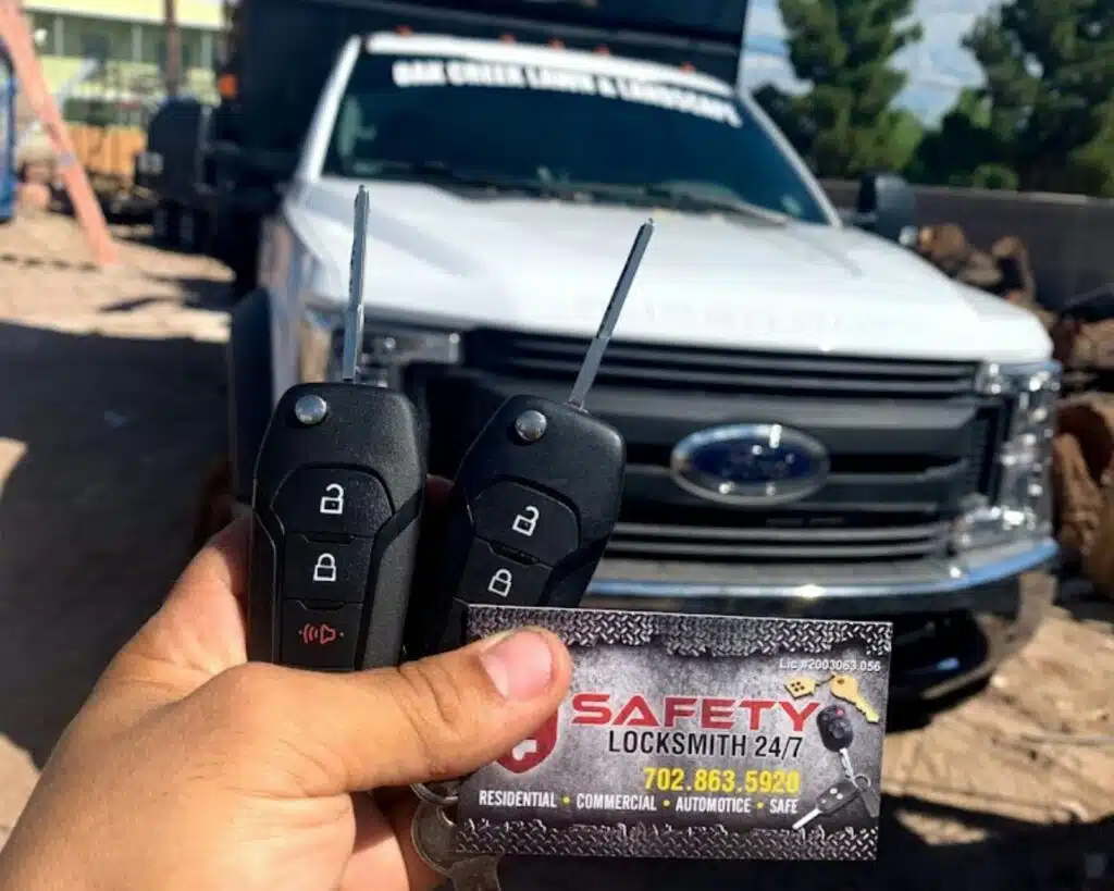 photo of car key with white pick up truck in the background