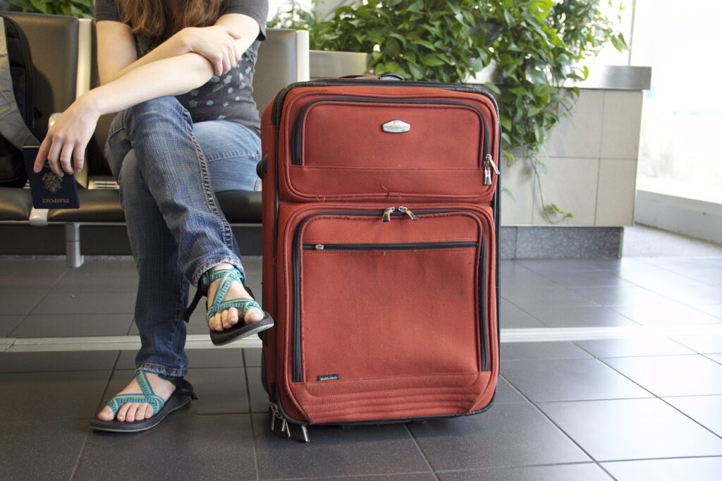 man with a luggage waiting on the airport