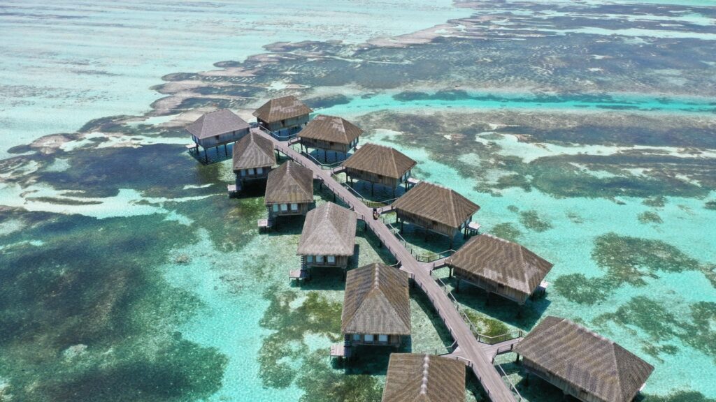 Aerial view of overwater cabanas in the Maldives.