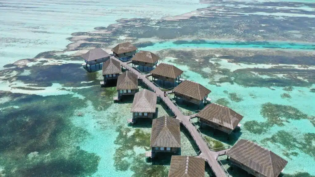 Aerial view of overwater cabanas in the Maldives.